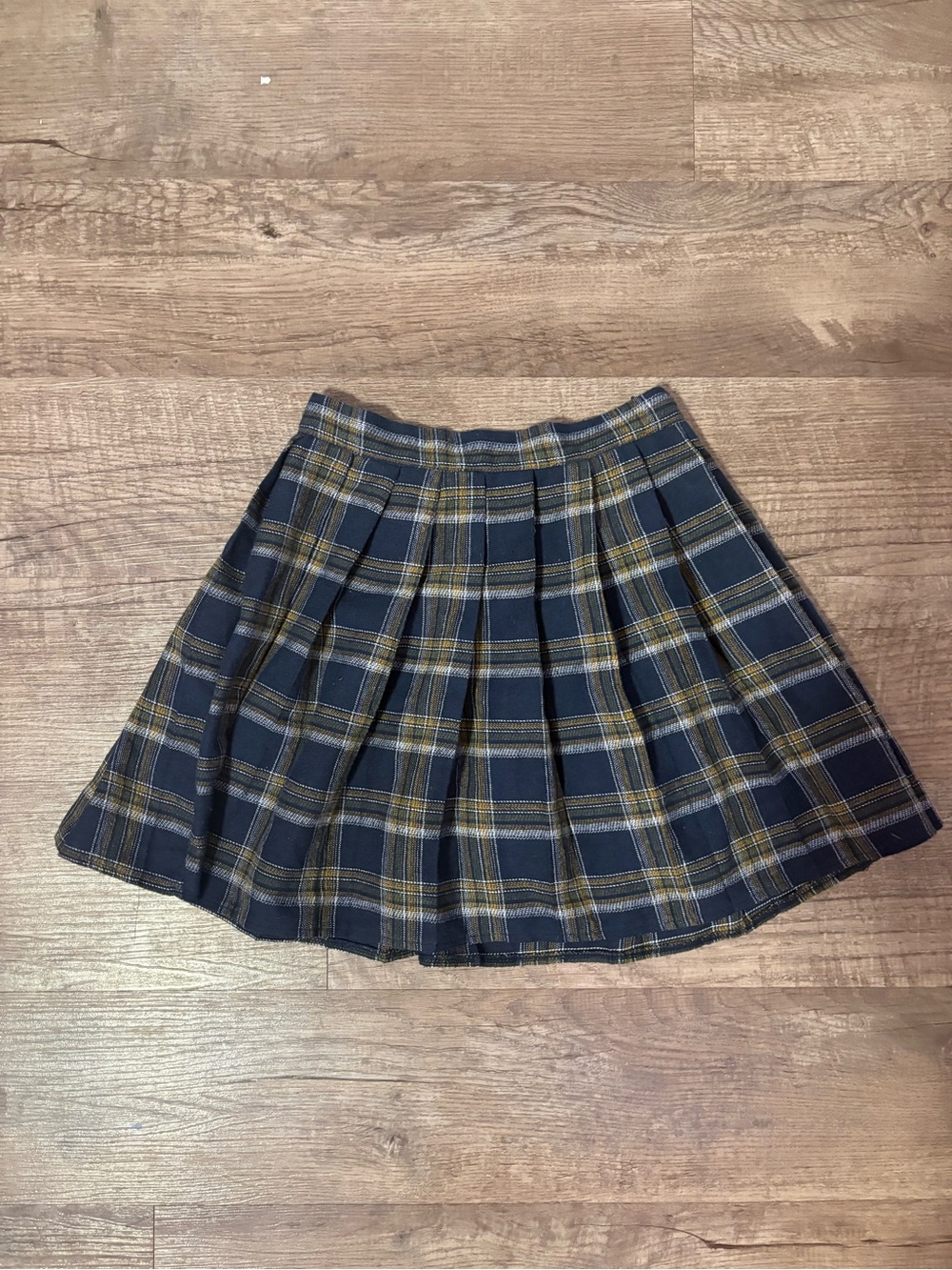 Navy blue, yellow, and white plaid pleated mini skirt in a S